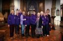 Volunteers withe Dereham Cancer Care gather for a special service to mark Turning Dereham Purple Day