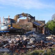 The bungalow being demolished