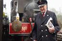 Alan Baker, 89, at the Whitwell and Reepham Station with his book 'A Life on the Rails'. Picture: DENISE BRADLEY