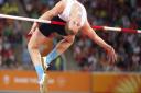 Chris Baker in action during the men's high jump final at the Carrara Stadium. Picture: PA