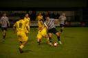 Charlie Clarke in action for Dereham Town in their 1-1 draw away at Bedworth United