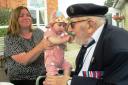 Second World War veteran Reginald Lewis with great-granddaughter Elodie on his 100th birthday in Dereham