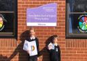 Pupils Grace and Archie pictured with their cards.