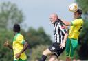 Norwich City's Ryan Bennett rises highest in the Canaries' 1-0 pre-season opening win at Dereham. Picture: Matthew Usher.