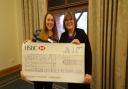 Jacquie Aldous presenting the cheque to Tracey Allan from Keeping Abreast. Picture: Keeping Abreast