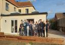 Staff and residents outside Westfield House in Dereham with Mid Norfolk MP George Freeman