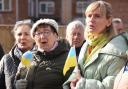Ukrainians sing at the planting of the Dereham Ukraine Aid Centre Peace Tree, marking a year since Ukraine was invaded