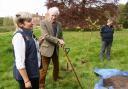 Donna Baldwin, left, general manager, with Sir Henry Paston-Bedingfeld, and Dea Fischer, senior gardener, at the planting of a linden tree to commemorate the King's coronation, at Oxburgh Hall.