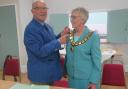 Former mayor Hugh King handed over the baton to Linda Monument at a town council meeting on May 21.