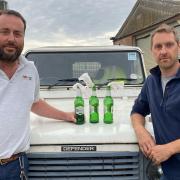 Farmers James Lake and Tim Barrell found three bottles, with tissue paper sticking out of the neck, on a roadside field margin near Dereham