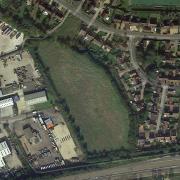 The plan proposes that the 48 homes go up on the oval-shaped field in the centre of the image.