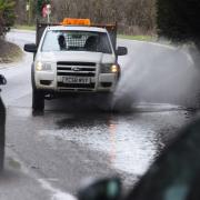 The flood on the A1705 at Shipdham thought to be caused by a blocked drain an overflowing ditch.