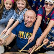 Pupils at St Mary's Primary School in Beetley, get a drum masterclass by former Status Quo drummer Jeff Rich - Pupils with Jeff Rich.. Picture: Matthew Usher.