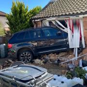 A car has crashed into a house in Dereham