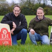 Peter Scott (left) and his brother Robert with horse feed made by EH Haylage at Beeston, near Dereham