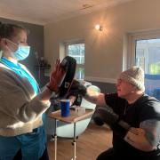 Michael Harper has embarked on his second fund-raising challenge, aiming to throw 10,000 boxing punches in a month, to support Ukrainian refugees. Thorp House support worker Beckie Stanford helping him.
