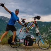 Alex Sidney is attempting to cycle around the world on a tallbike.