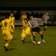 Charlie Clarke in action for Dereham Town in their 1-1 draw away at Bedworth United