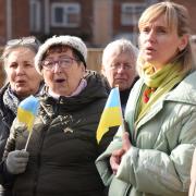 Ukrainians sing at the planting of the Dereham Ukraine Aid Centre Peace Tree, marking a year since Ukraine was invaded