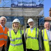 Outside the Swaffham Assembly Rooms, currently being refurbished by the Swaffham HAZ project partners, Liz Truss meets with Breckland Councillor Paul Claussen, Tony Calladine from Historic England & Dennis Tallon from the ICENI partnership