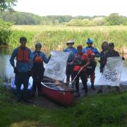Members of the Dereham Canoe Group cleaning up the River Waveney