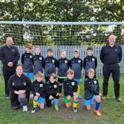 Vincent Theobald, left, Gary Yates right, from Amp & Deck Events with Dereham Saints U12s and coach Jo Webster.