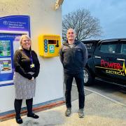 Jennie Müller, head teacher at Yaxham Primary, and Cllr Gary Davidson of Yaxham Parish Council, with the new defibrillator