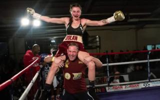 Emma Dolan, from Dereham, after winning the female super flyweight Commonwealth title, with trainer Carl Greaves