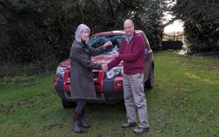 Josephine Phillips hands over the keys to her Landrover Freeland to Trevor Power as he will take the car to Ukraine to help out there as part of the Cars for Ukraine effort