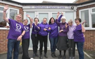 A group from Dereham Cancer Care celebrating purple day in tribute to their founder Janet Money
